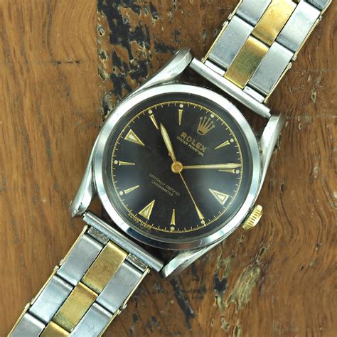 rolex bombay black gold